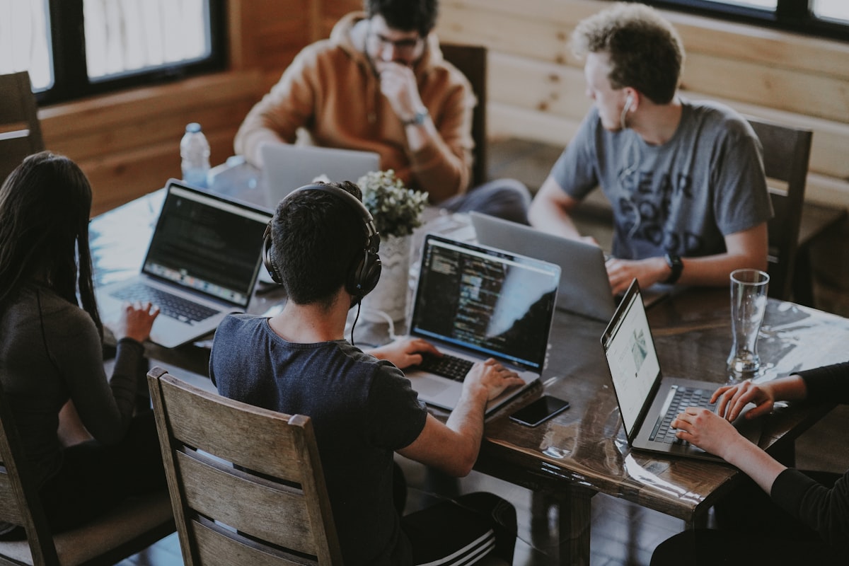 Group of people using laptop computers
