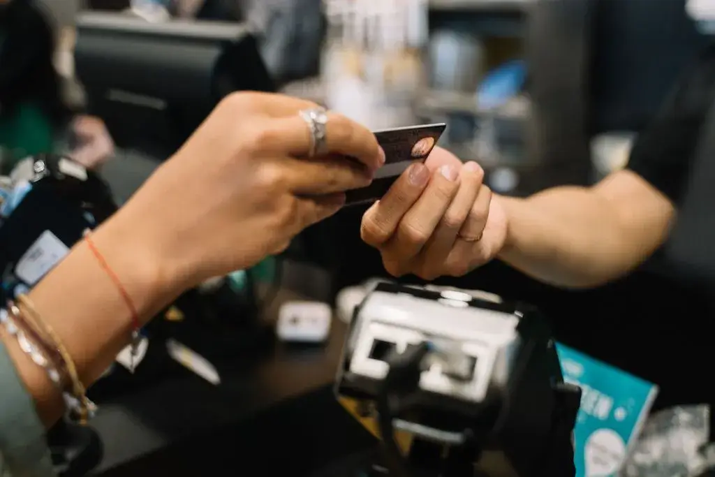 Bank card being handed over