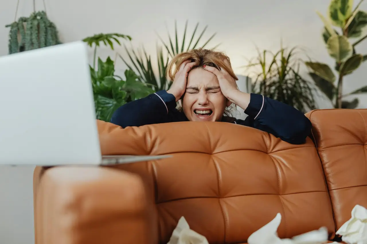 Woman leaning on a sofa
