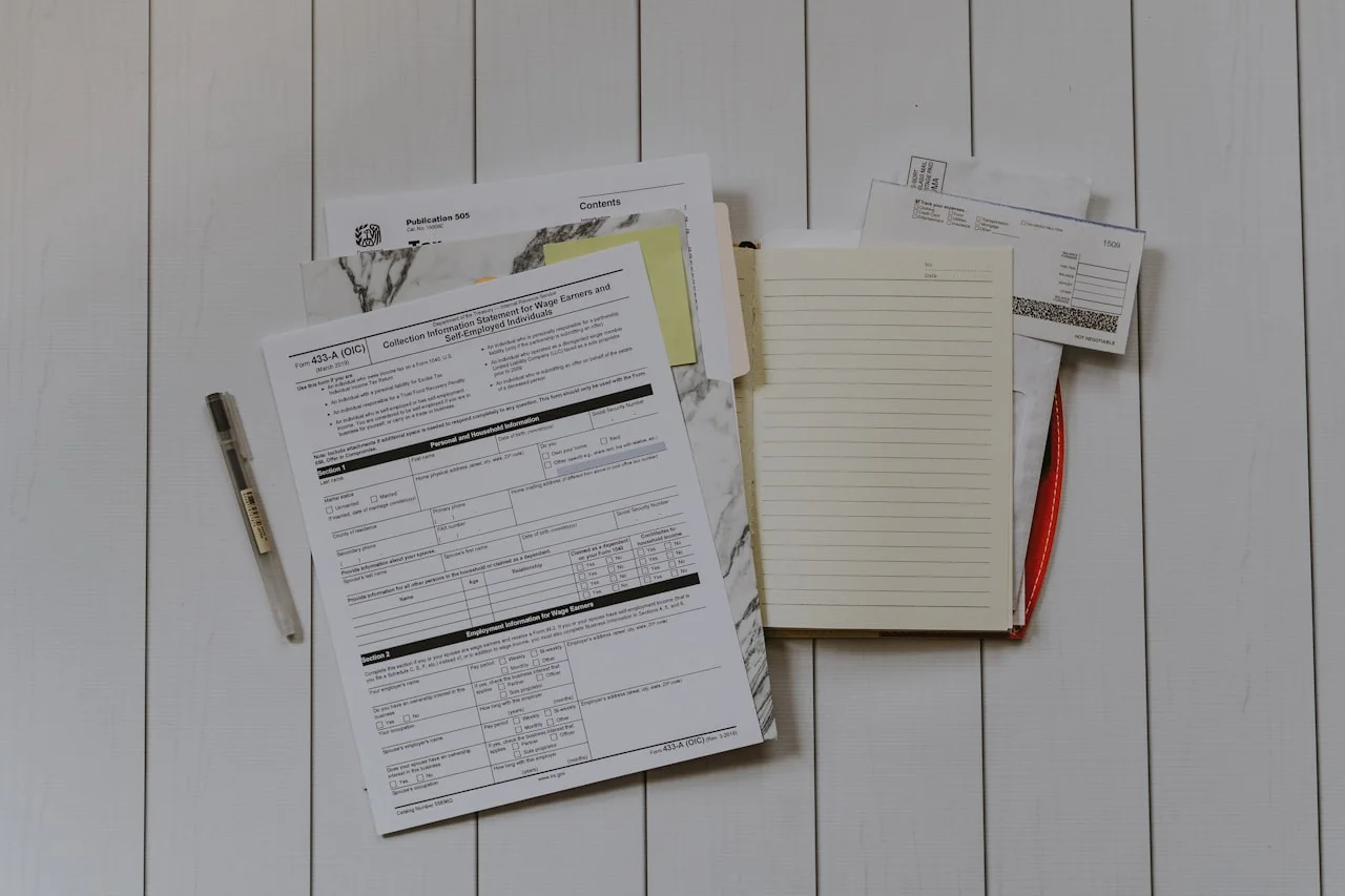 Stack of papers flat lay (Kelly S., Unsplash)